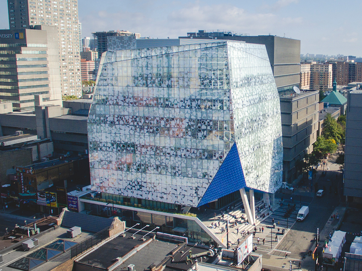 An overhead shot of the SLC building on Toronto Metropolitan University’s campus / An overhead shot of the Kerr Hall quad on TMU campus, an older square building with an open green field in the middle.   